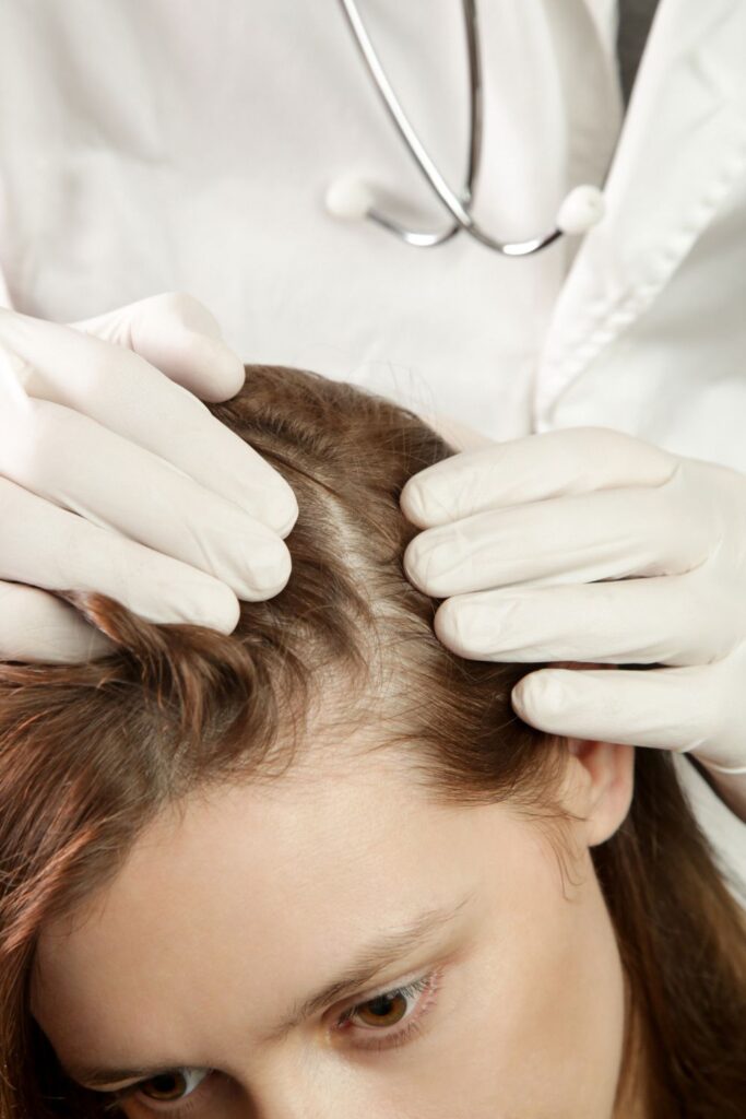 someone getting scalp checkup as one of the healthy scalp habits 
