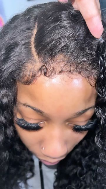 someone caring for her afro hair under wig