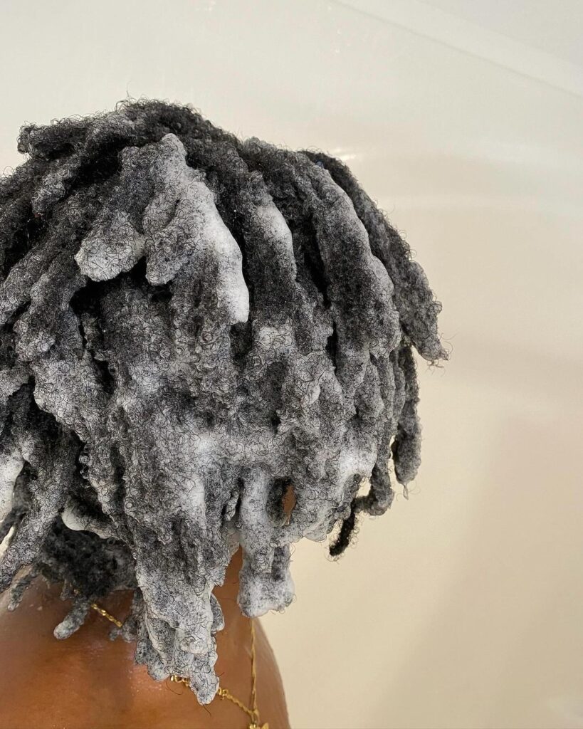 someone that is shampooing her hair