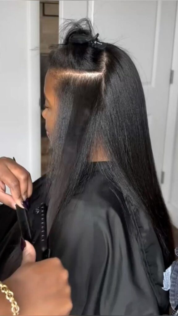 someone getting silk press on natural hair