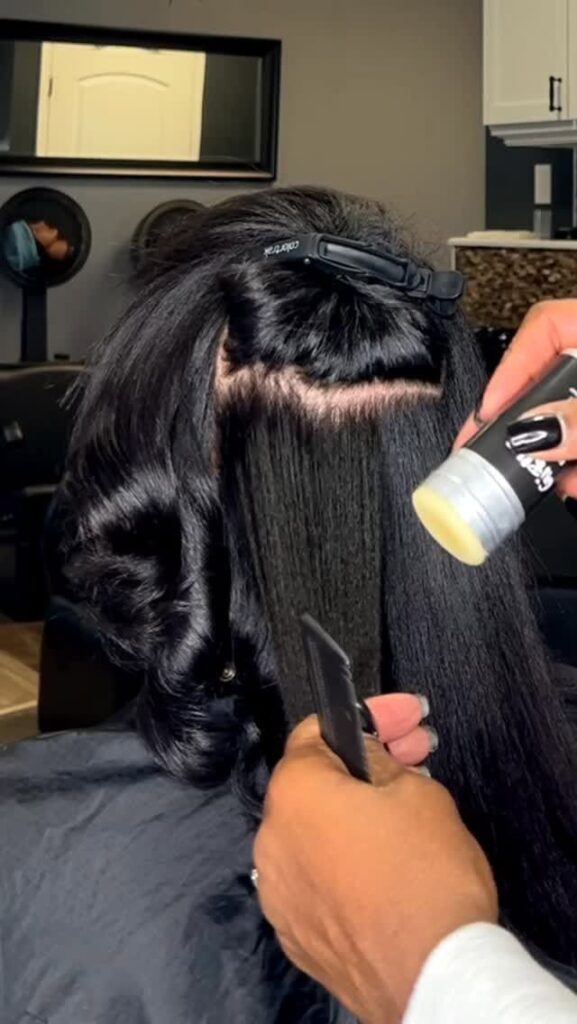someone silk pressing her hair