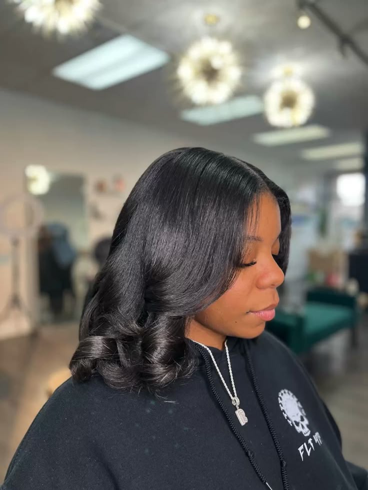 someone with a silk press on her natural hair
