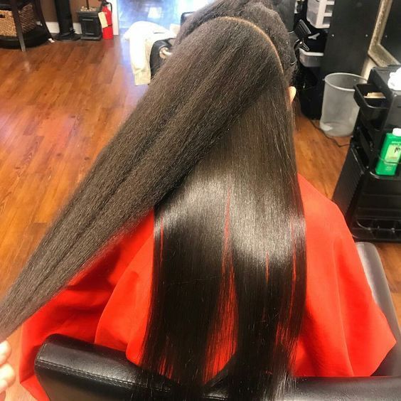 someone showing her silk press vs blowout hair