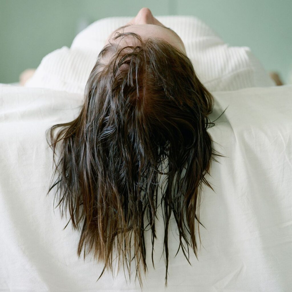 someone that is sleeping with wet hair