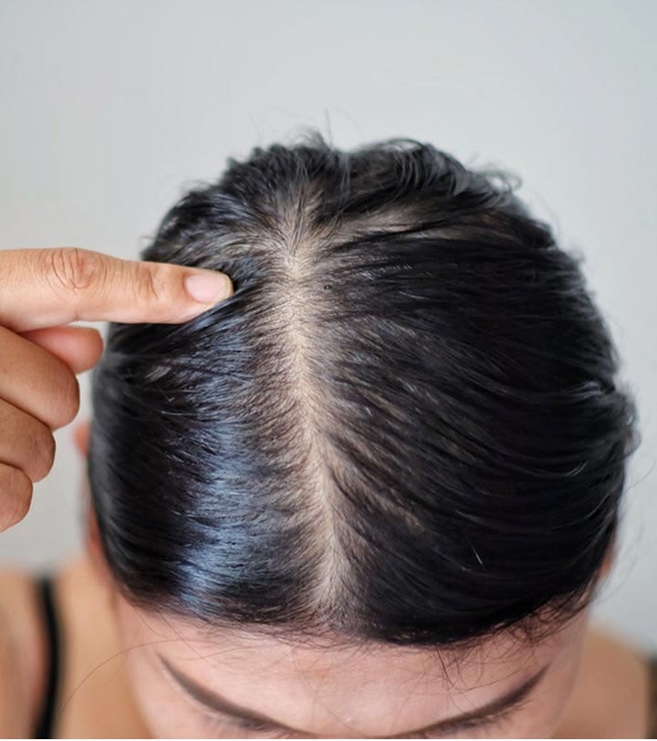 someone checking her scalp
