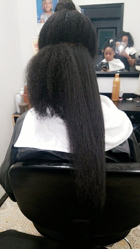 someone that is getting her hair stretched