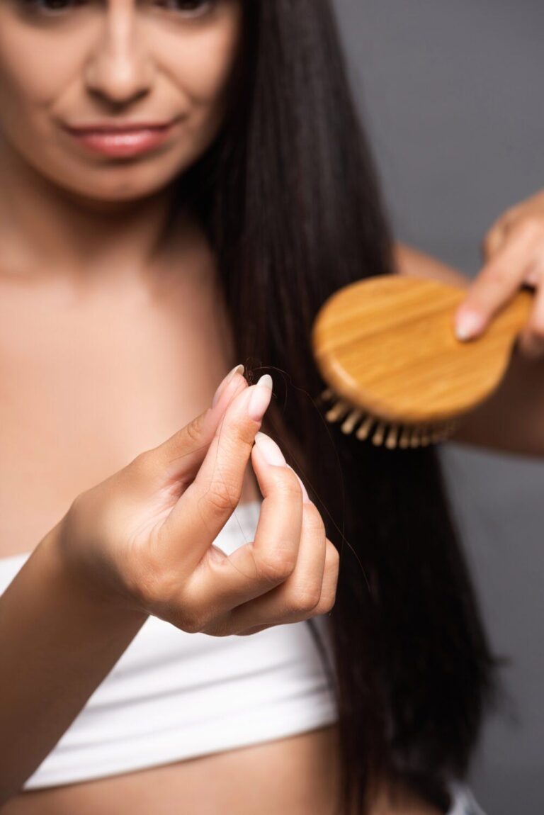 someone holding a strand of her hair
