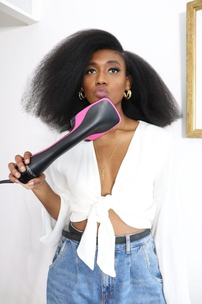 someone holding a blow dryer