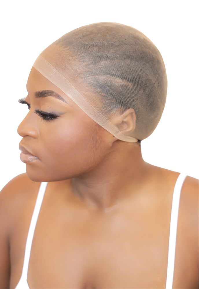 someone putting on a light wig cap