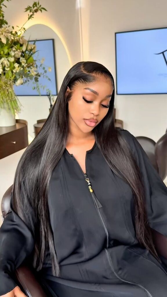 someone putting on a wig