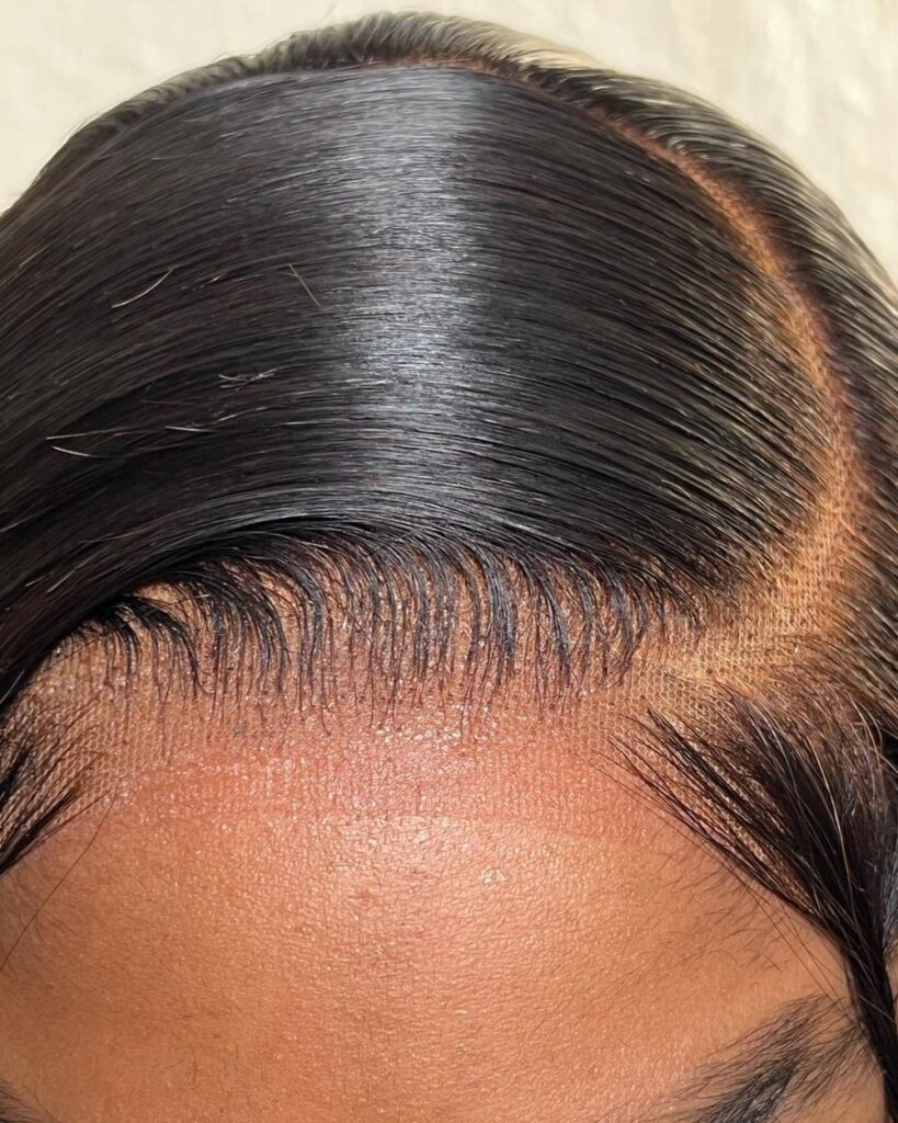 someone with wig over natural hair
