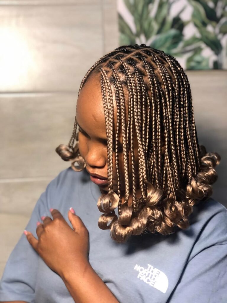 someone with knotless braid that could be damaging your hairline