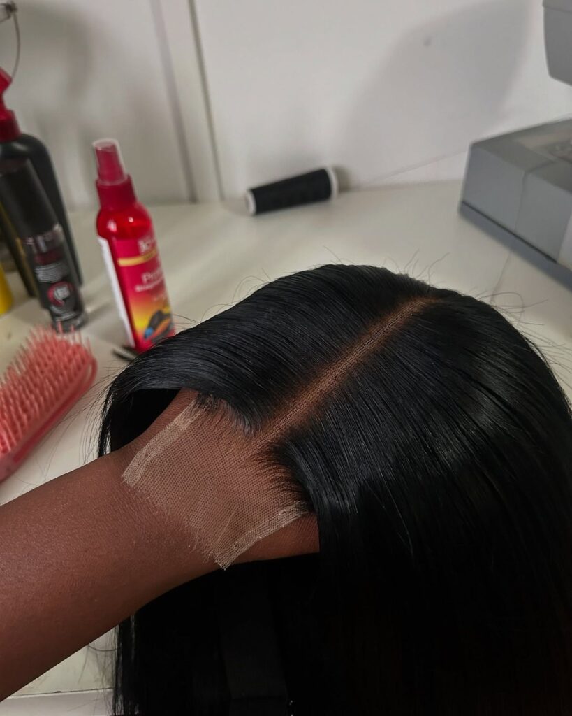 someone holding a wig