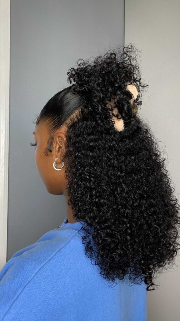 someone with a styled curly hair