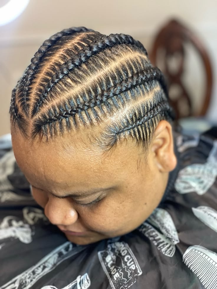 someone with cornrows hairstyle