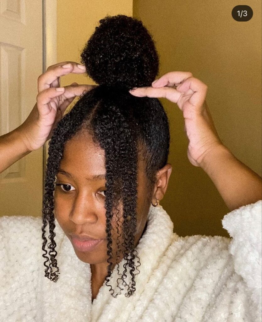someone with updo with some strands by both sides