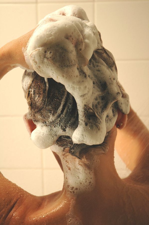 someone washing her hair