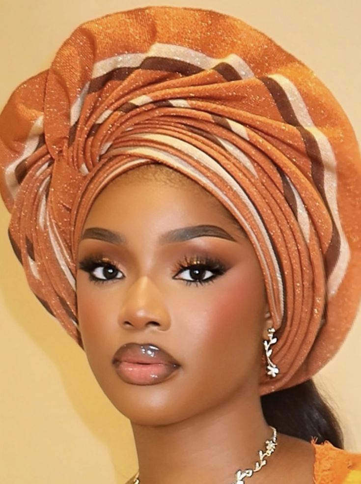 someone with african print gele inspired headwrap