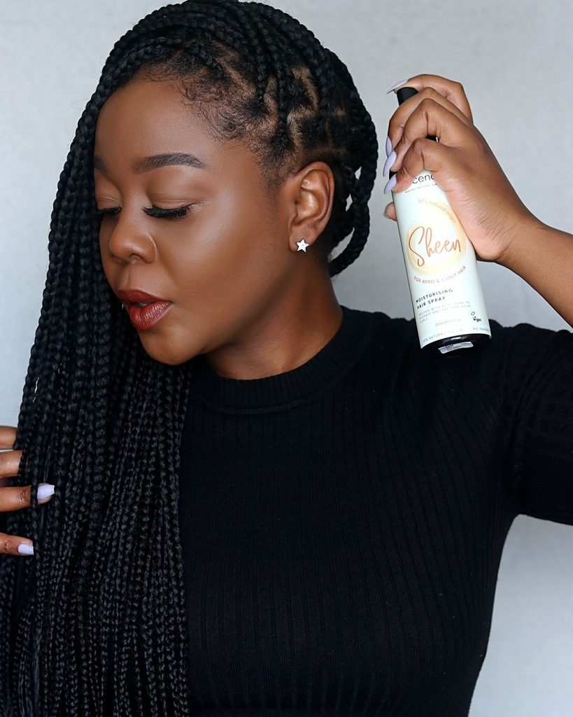 someone applying hair product to hair