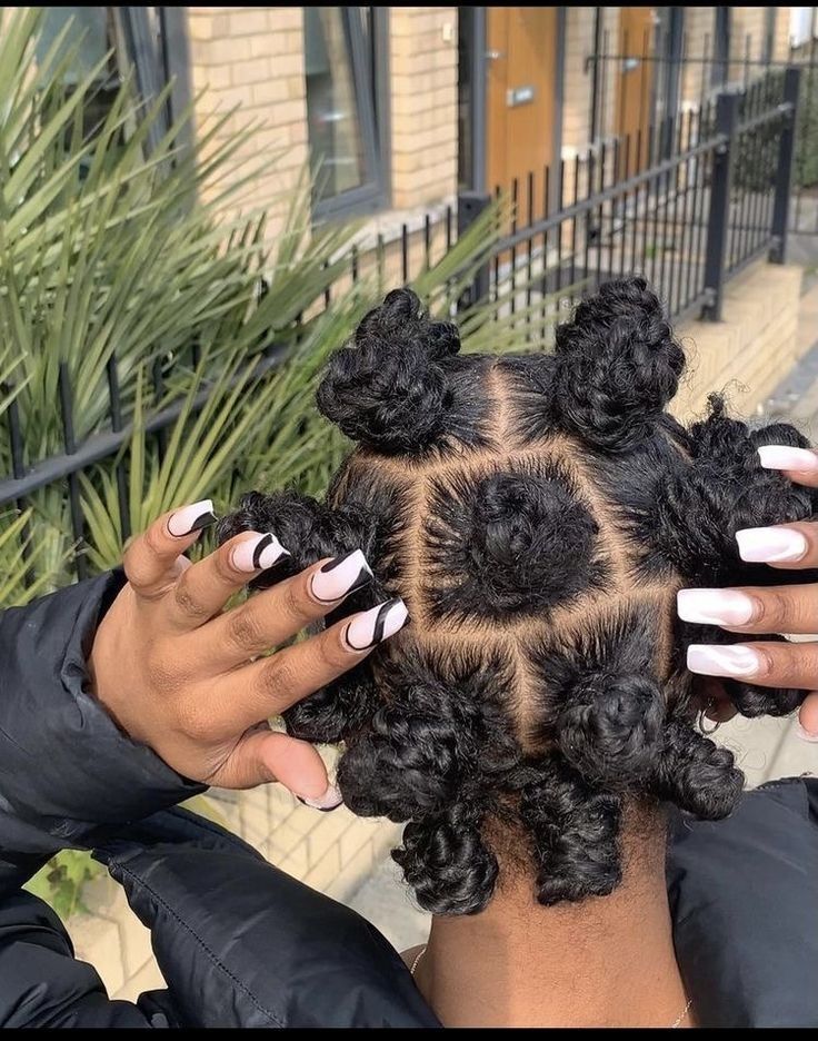 someone with bantu knots with twists