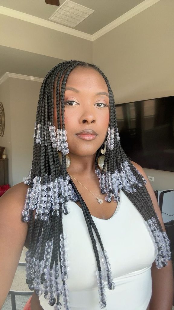someone with beaded braids