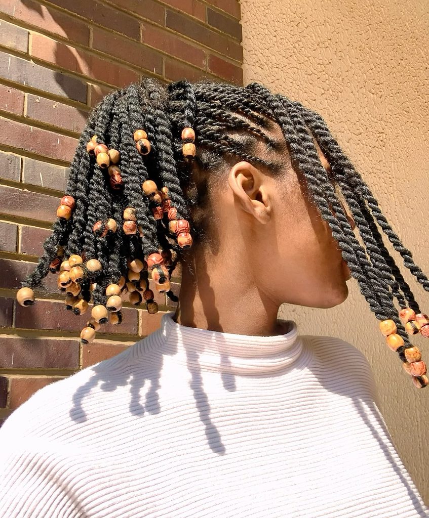 someone with beaded twist