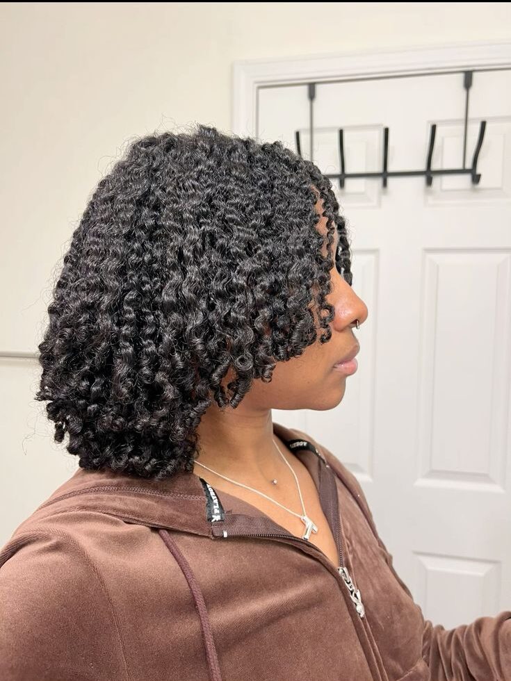 someone with braid out afro hairstyle
