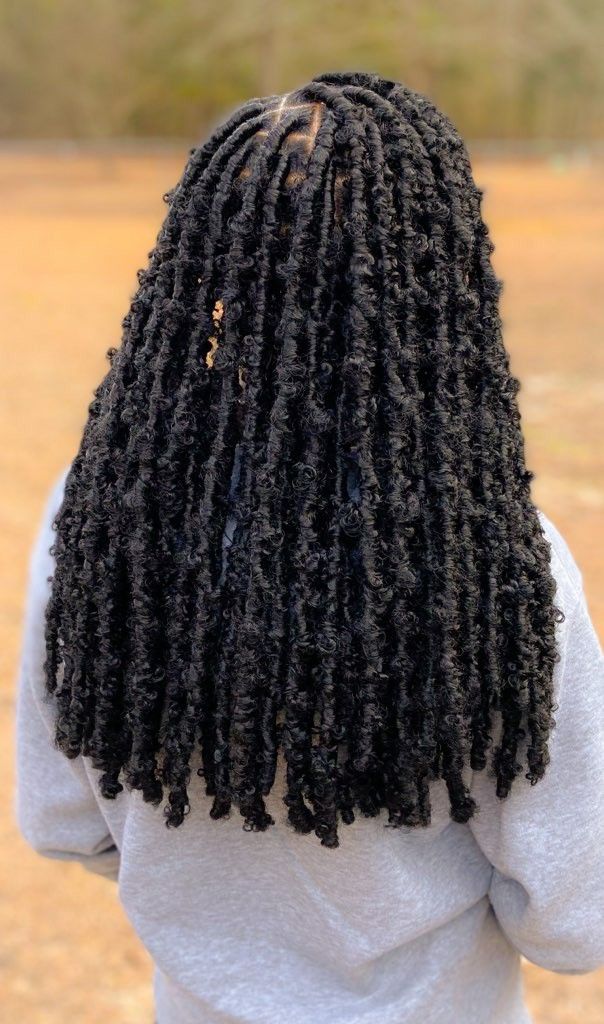 someone with butterfly locs afro hairstyles