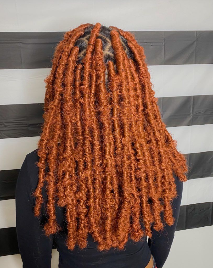 someone with colored faux locs