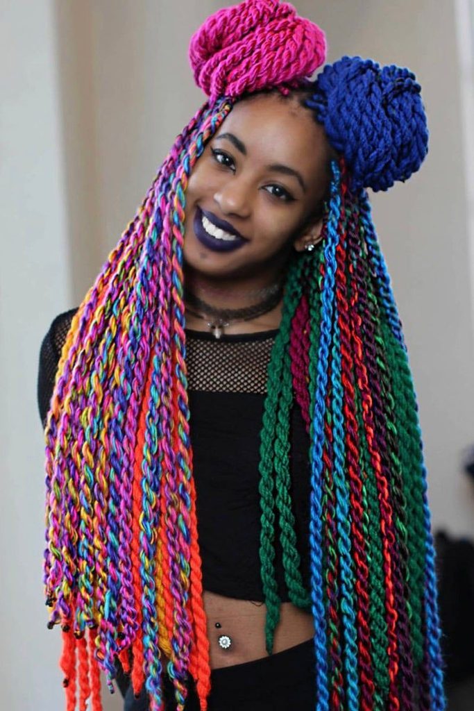 someone with colorful yarn twists