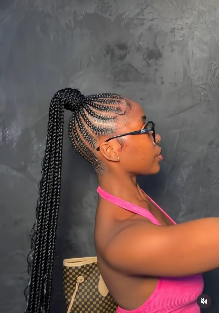 someone with cornrows ponytail