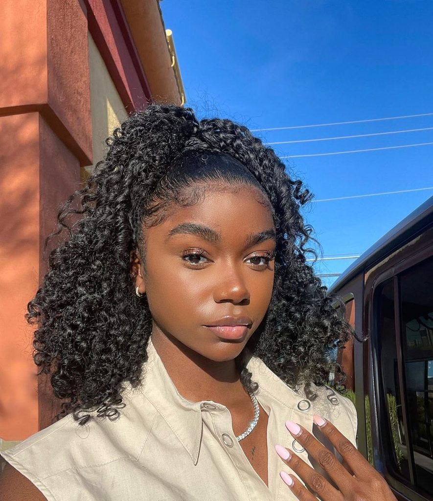 someone with curly half up 