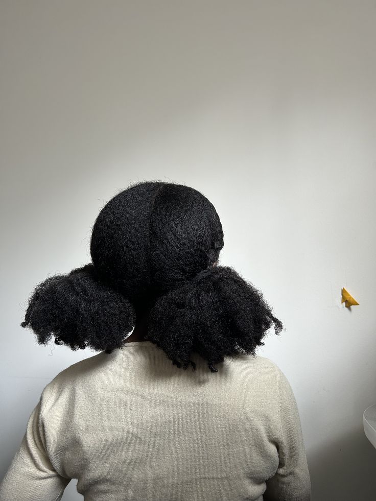 someone with double puff pigtails