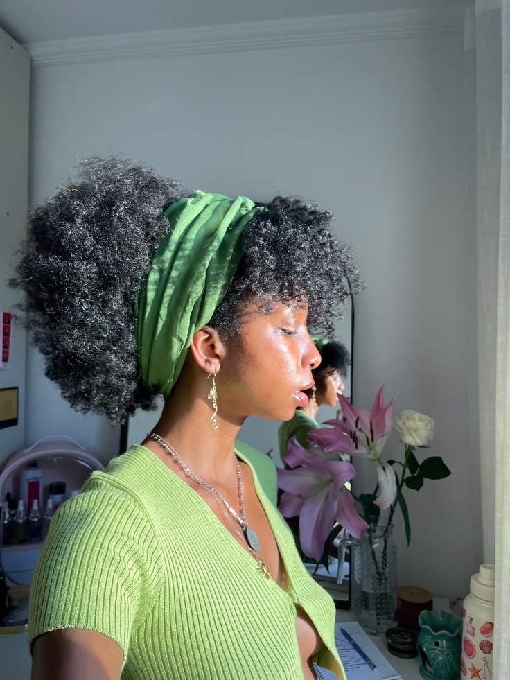 someone with half headwrap with curls as one of the cute headwrap styles for bad hair days