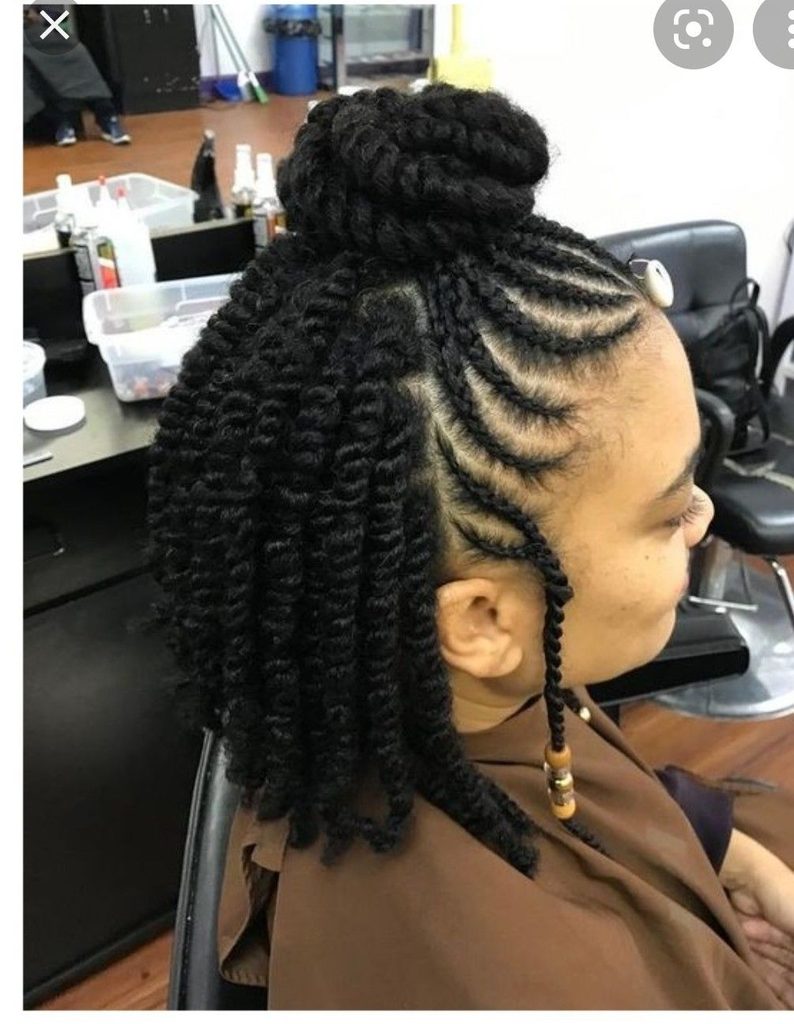 someone with half up cornrow style