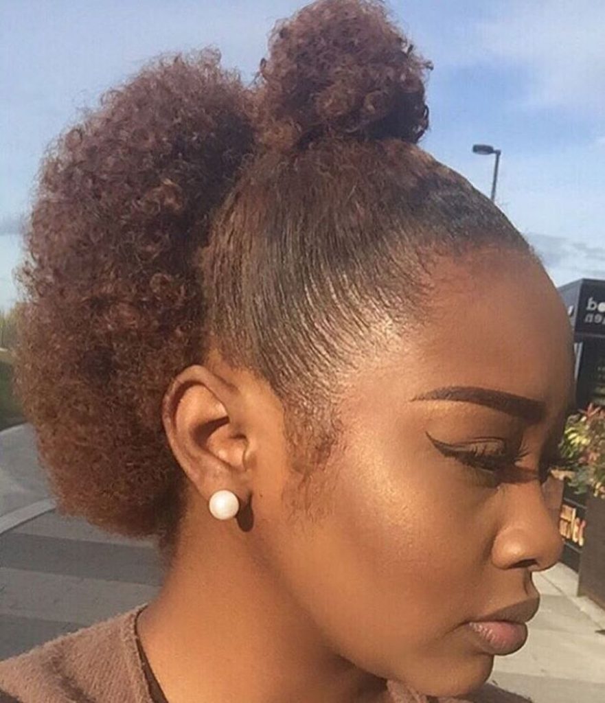 someone with half up styles as one of the ways to style awkward-length natural hair