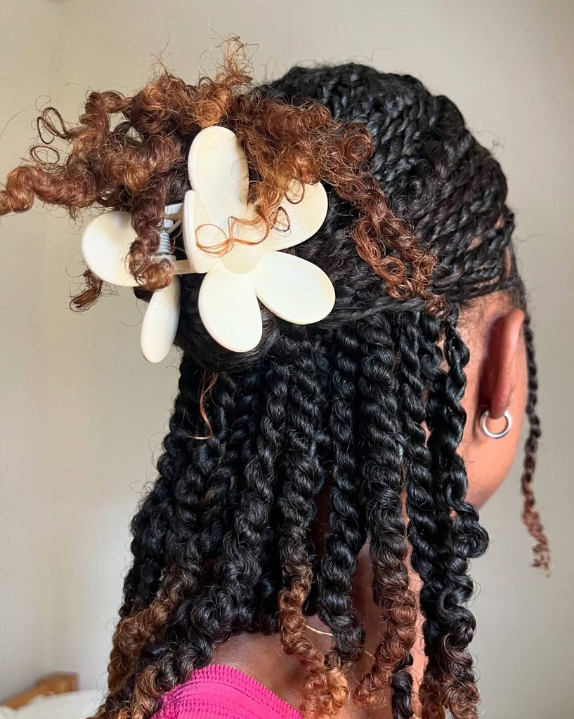 someone with half up twisted style