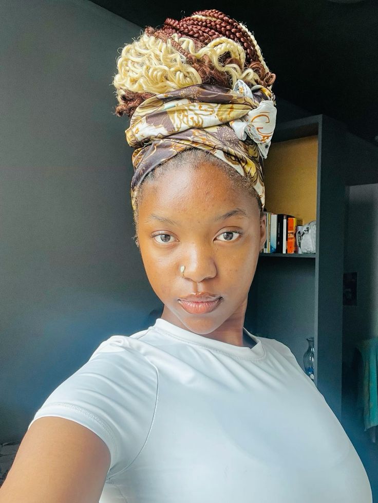 someone with headwrap over braids