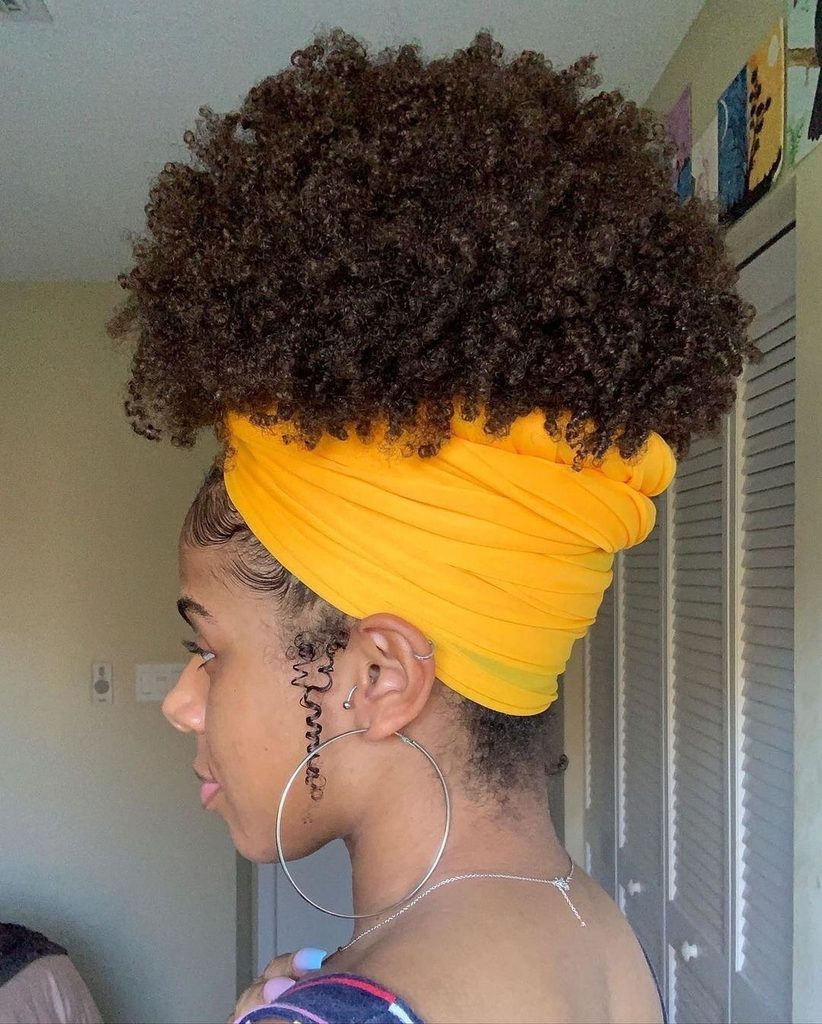 someone with high wrap with puff underneath cute headwrap styles for bad hair days