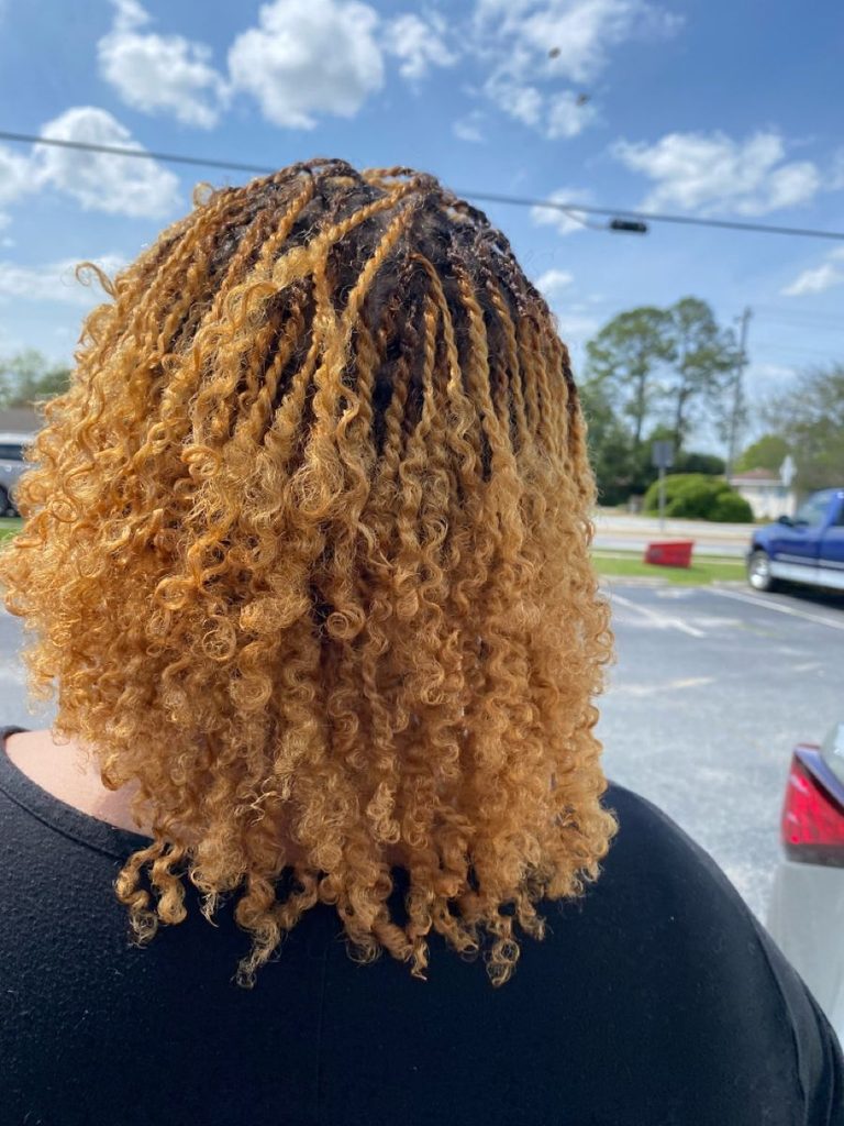 someone with honey blonde twists
