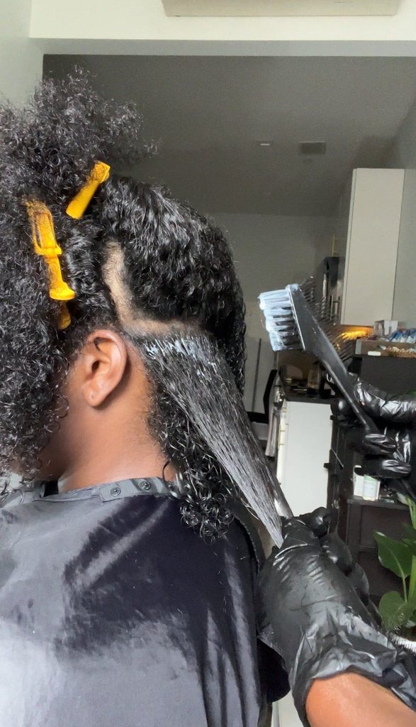 someone getting keratin smoothing treatment