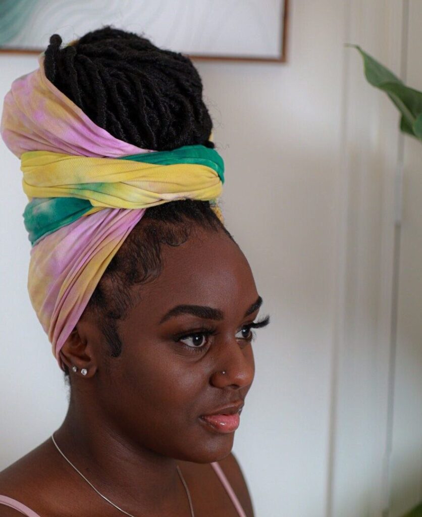 someone with layered double wrap as one of the cute headwrap styles for bad hair days