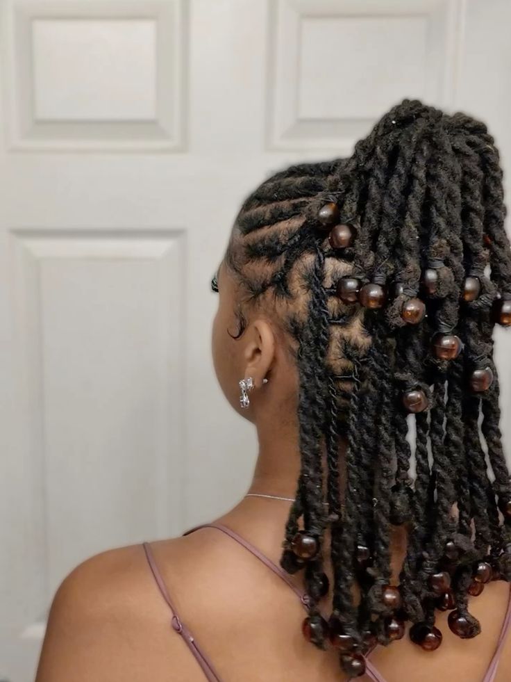 someone with loc updo with beads
