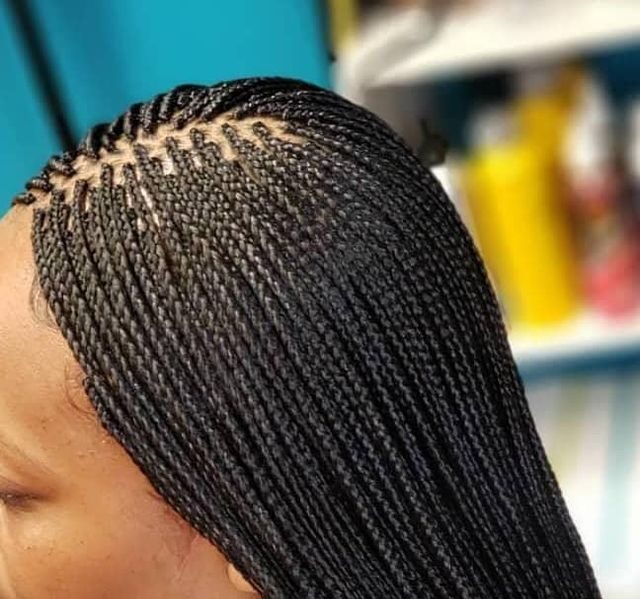 someone with micro box braids protective styles