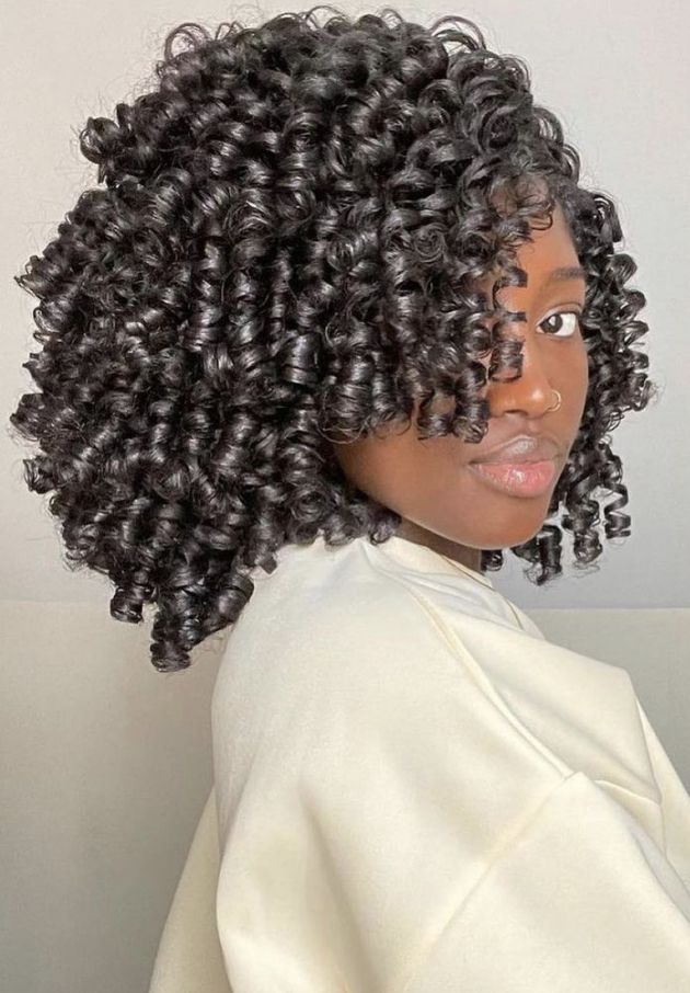 someone with perm rod set afro hairstyle
