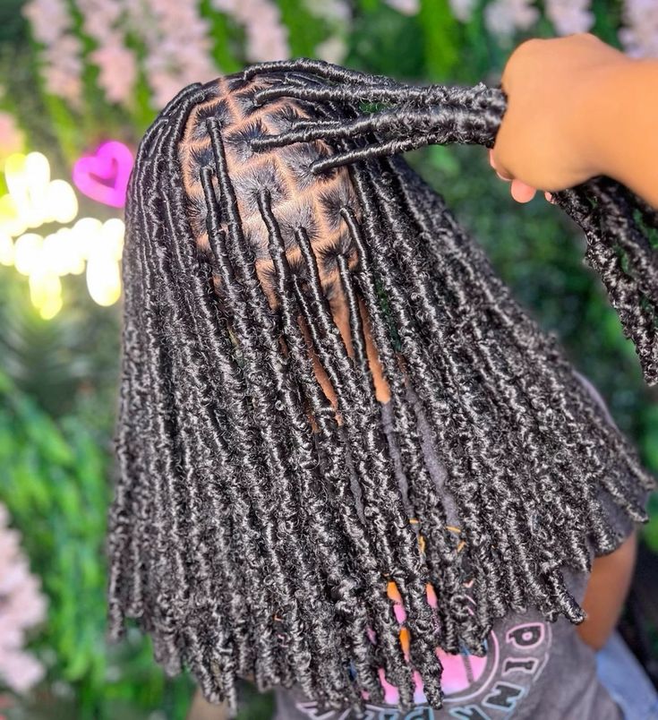 someone with soft locs afro hairstyles