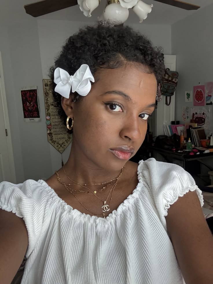someone with short hair with bow