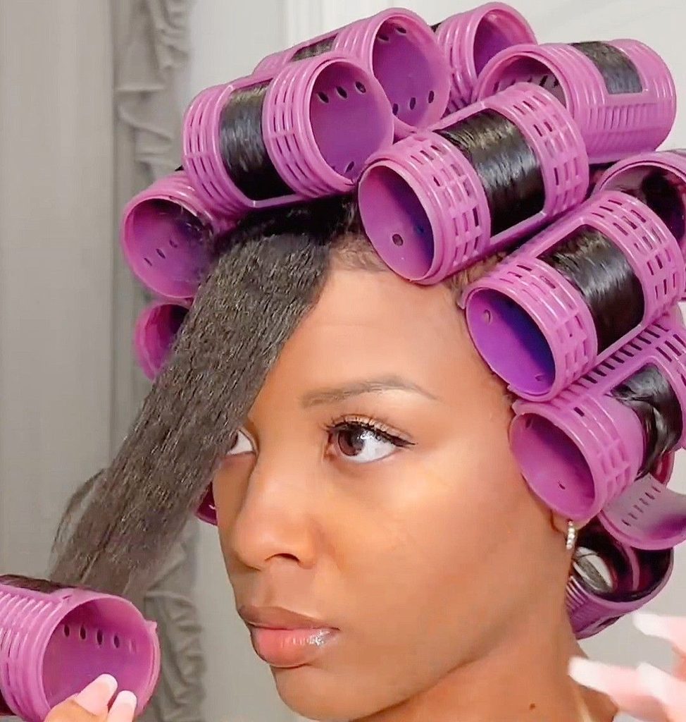 someone setting up hair rod set