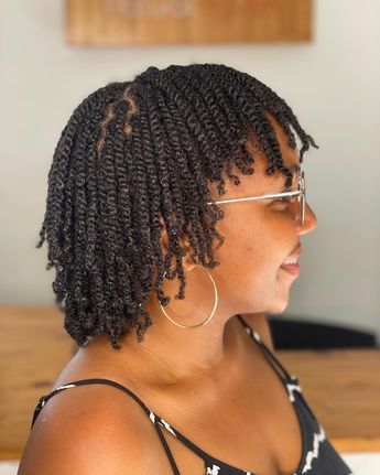 someone with twists on short natural hair
