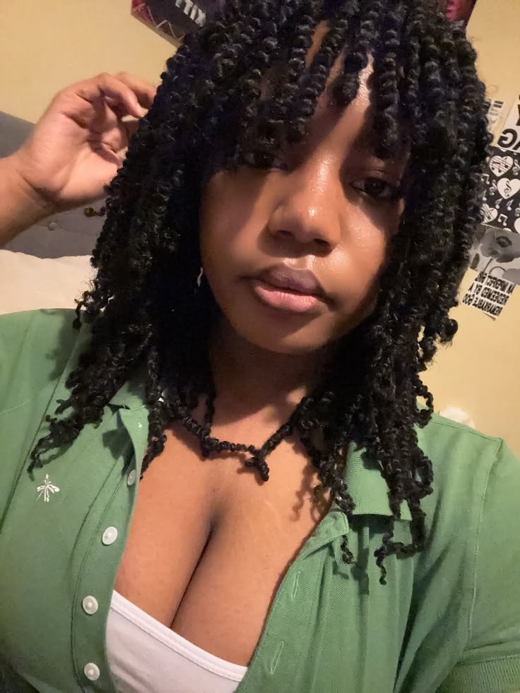 someone with twists with bangs
